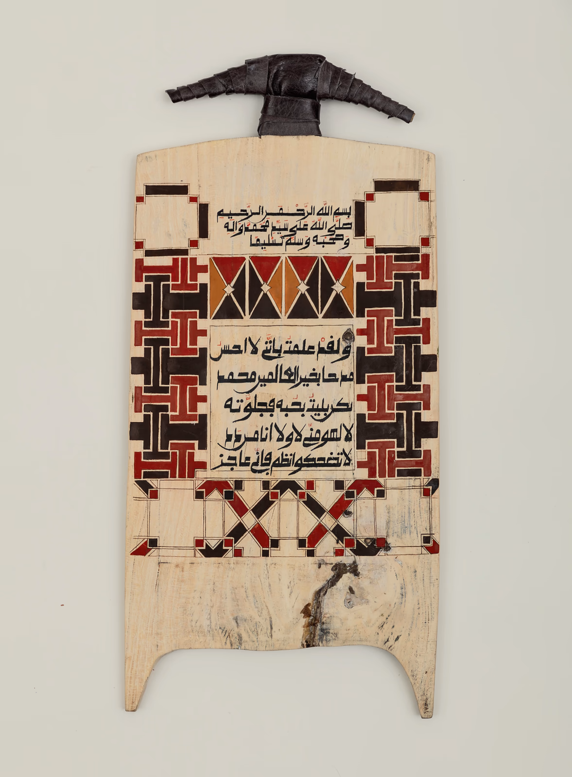 Decorated wooden board with Arabic calligraphy