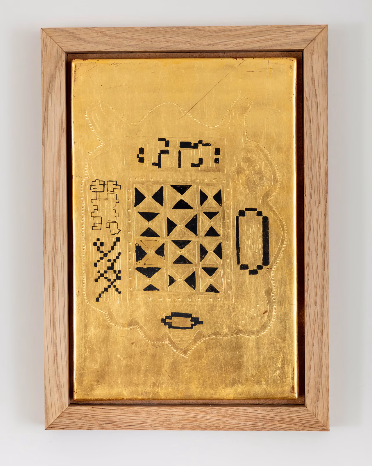West African Quran cover etched in gilded gesso board